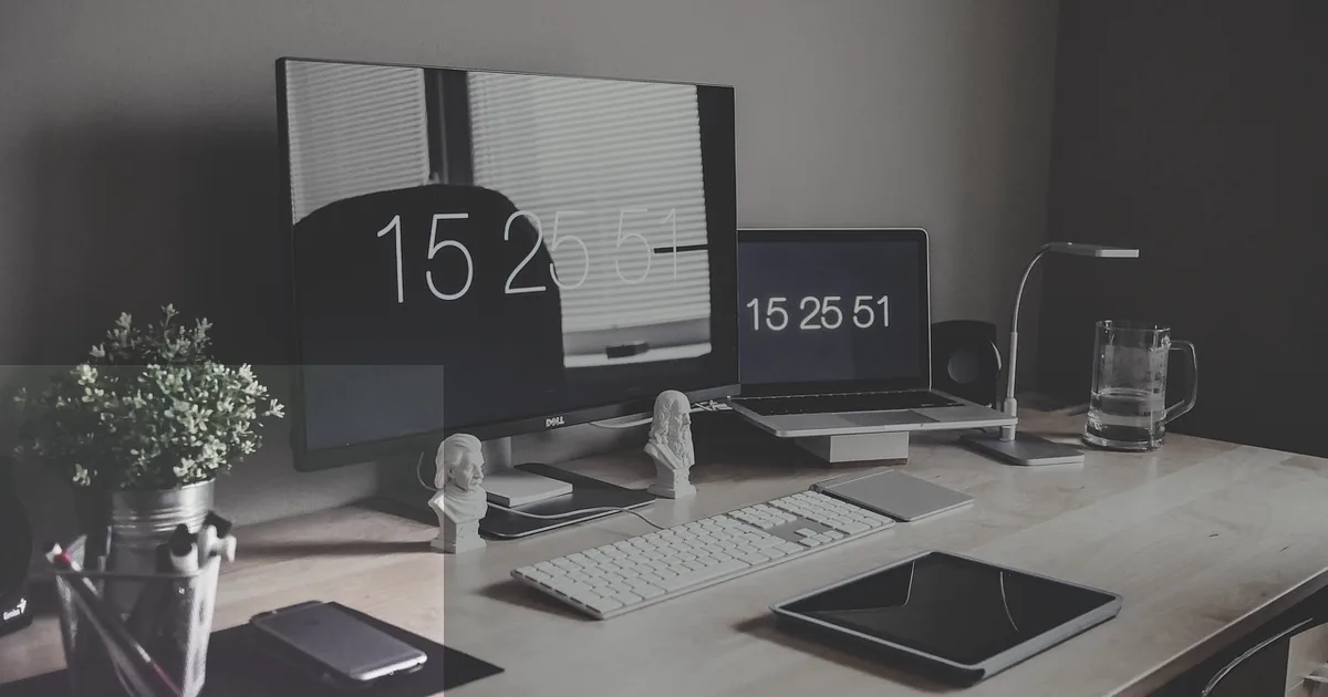 A professional dual-monitor desk setup — the right workstation ergonomics reduce neck strain